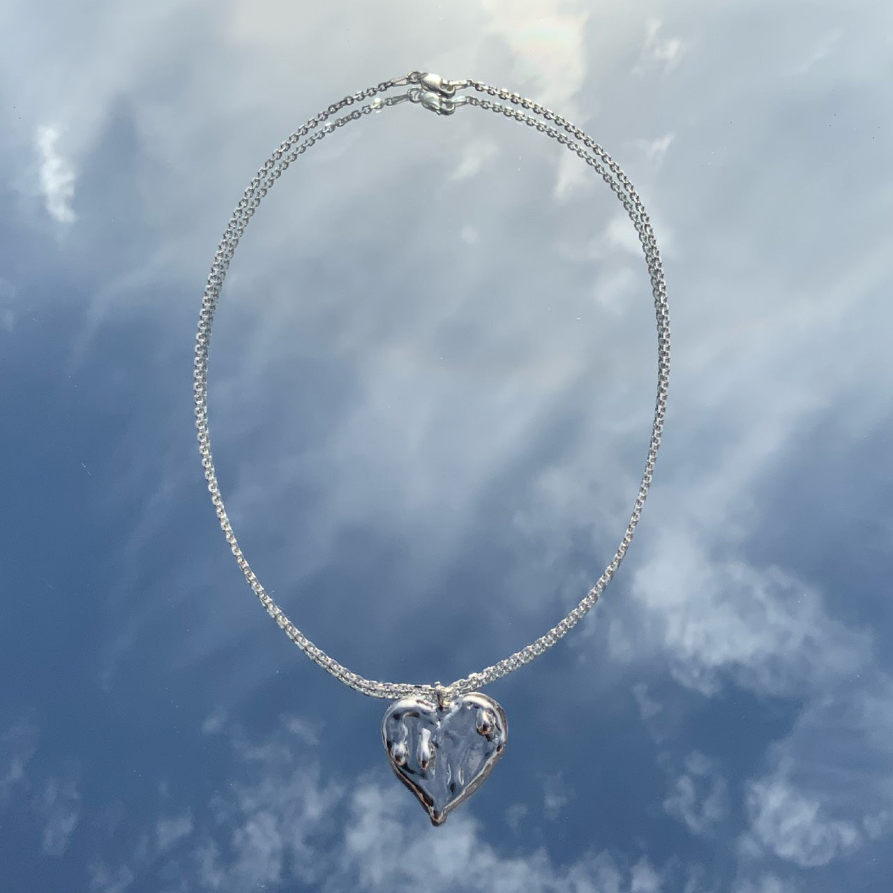 Melted heart necklace