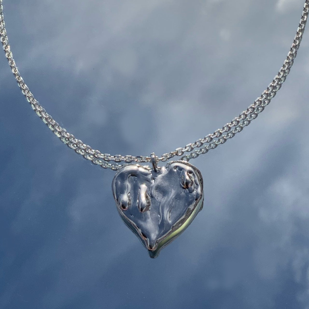 Melted heart necklace