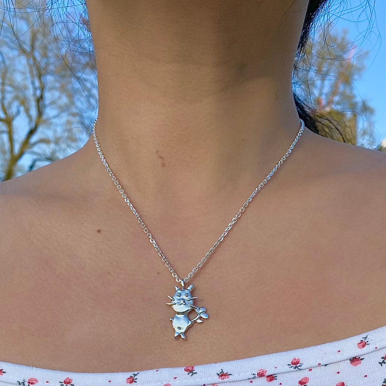 Cat with flower necklace